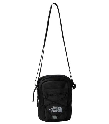 Bolso bandolera The North Face Jester Crossbody negro y gris con cordones elásticos frontales y correa ajustable.