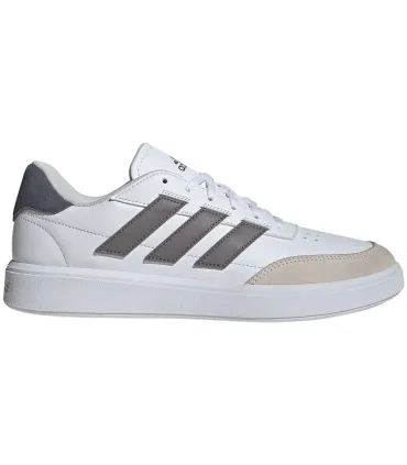 Zapatillas blancas Adidas Courtblock 09 para hombre, estilo casual minimalista con suela de goma resistente.