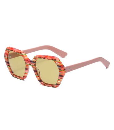 Gafas de sol polarizadas Ocean Santa Giulia con montura rosa floral y lentes amarillas.